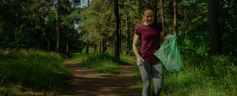 Volunteer helping keep trails clean